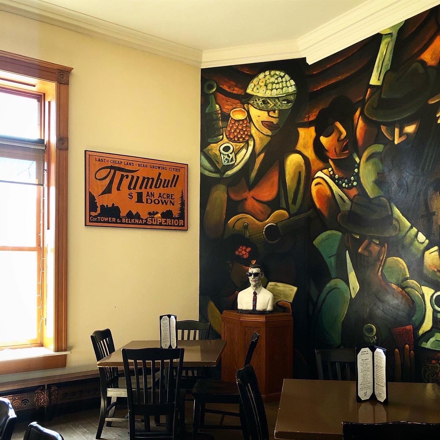 Spirit Room interior featuring Art Deco mural and vintage decor